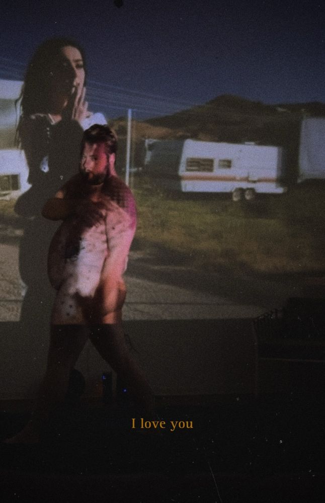 Me in front of a projector with an old-school film grain on it and the words I love you written at the bottom in gold