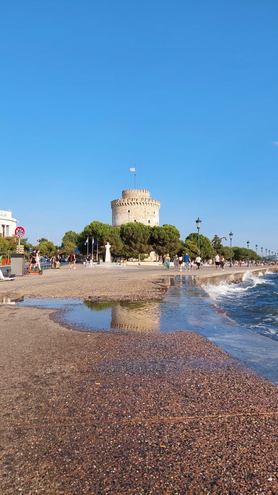 Beautiful white tower and reflection in sea water (Thessaloniki, Greece)