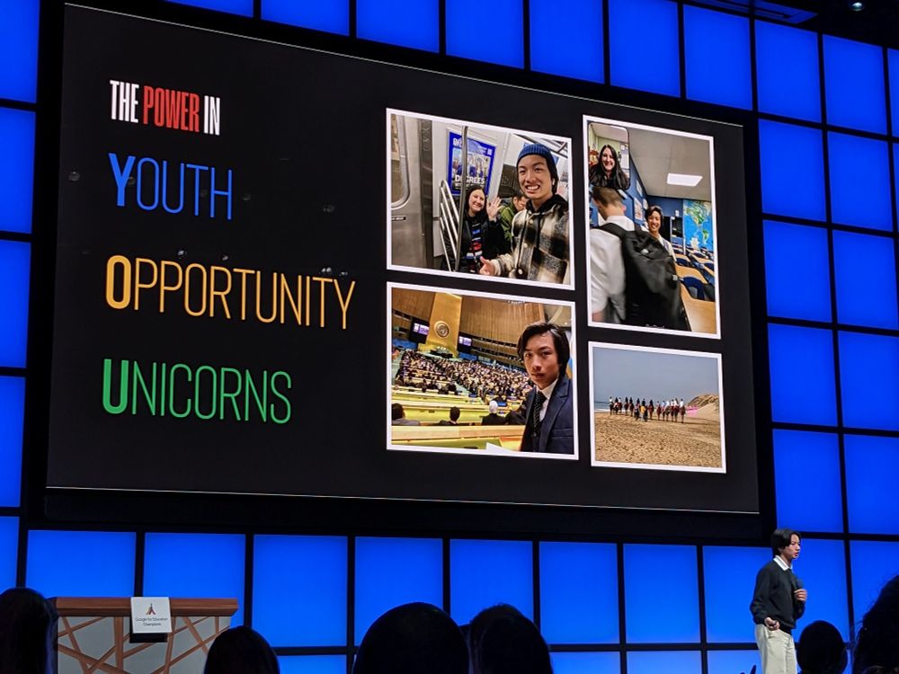 Student presenting on a stage in front of a slide that says The Power of YOU. Youth, opportunity, unicorns