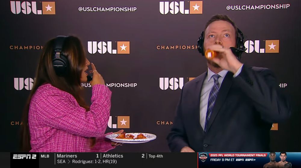 Mike Watts taking a swig of the hot sauce as Marion looks on in horror 