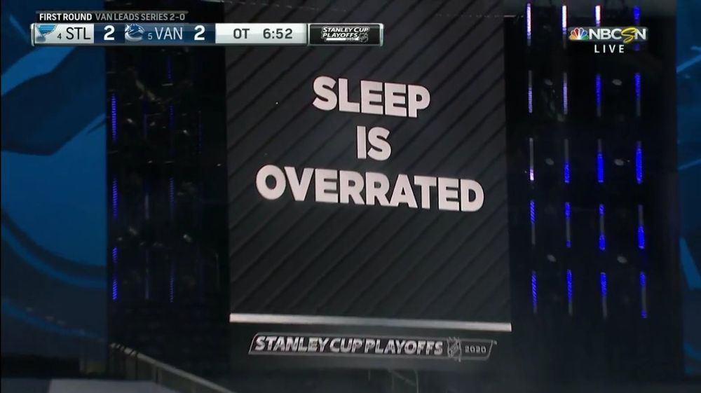NHL board saying "Sleep is Overrated" during St. Louis-Vancouver