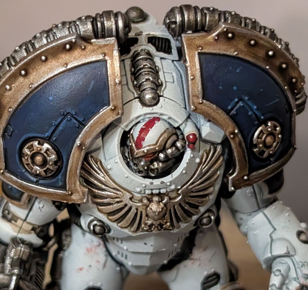 A close up of the shoulders, face, and head. The head is so small in comparison to the rest of the model that they look even more inhuman than a regular Terminator.