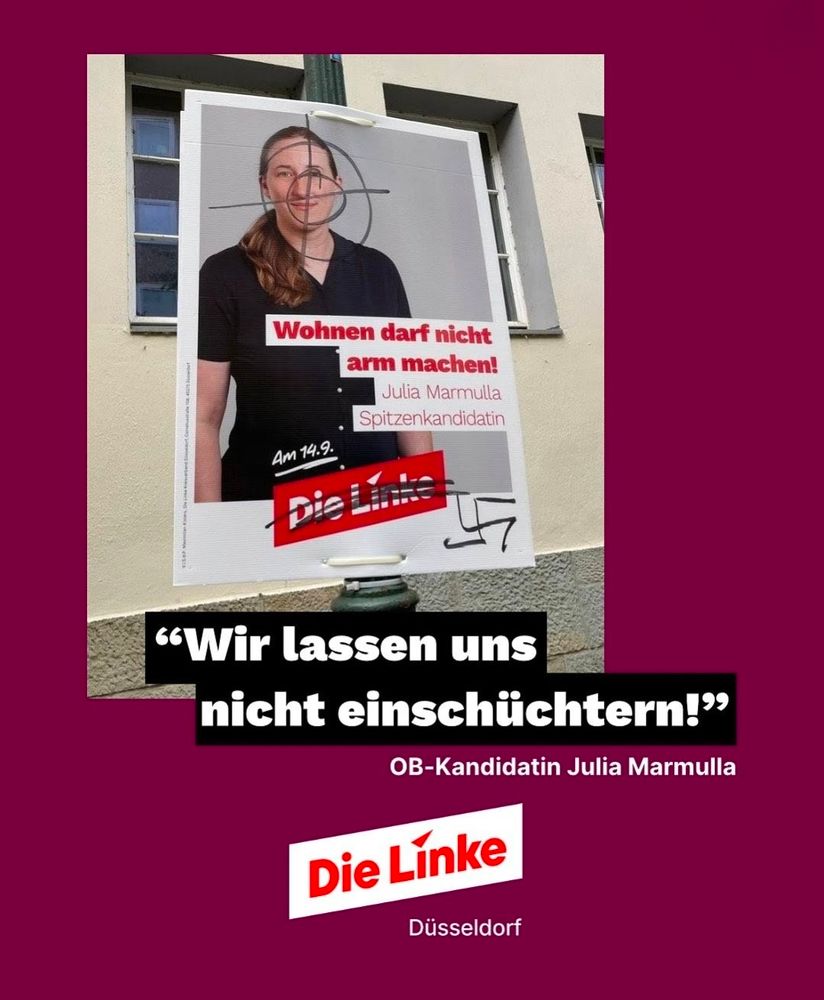 Das Bild zeigt ein Wahlplakat der OB-Kandidatin Julia Marmulla (Die Linke Düsseldorf), das mit einem Fadenkreuz über dem Gesicht und einem Hakenkreuz beschmiert wurde – eine rechtsextreme Drohung. Darunter steht in Weiß auf schwarzem Balken:
„Wir lassen uns nicht einschüchtern!“ – OB-Kandidatin Julia Marmulla.
Unten ist das Logo von Die Linke Düsseldorf.

