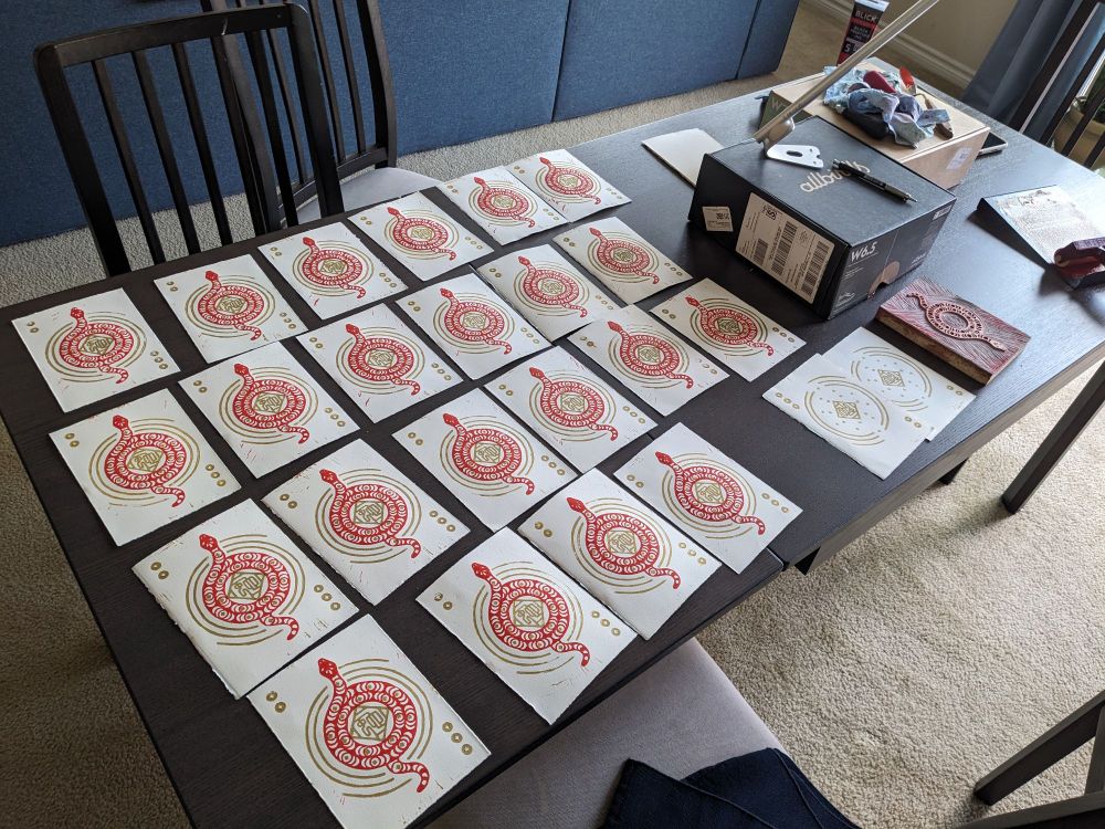 24 cards and block printing materials on a dining table