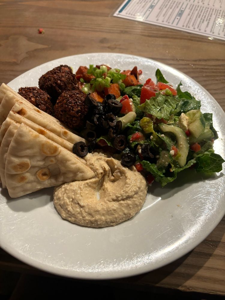 falafel veggie plate with greek salad, pita bread and hummus