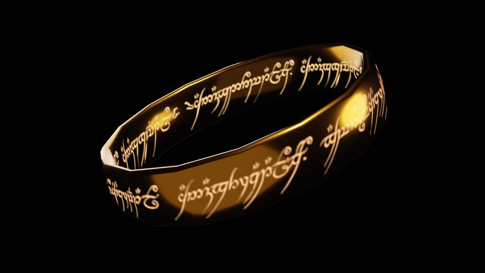 A model of the one ring from lord of the rings on a black background. The elvish inscription on the inside and outside glows. 