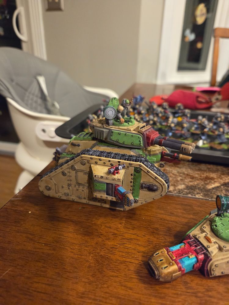 Leman Russ Exterminator, painted in tan armor with green and grey highlights and ready for battle 