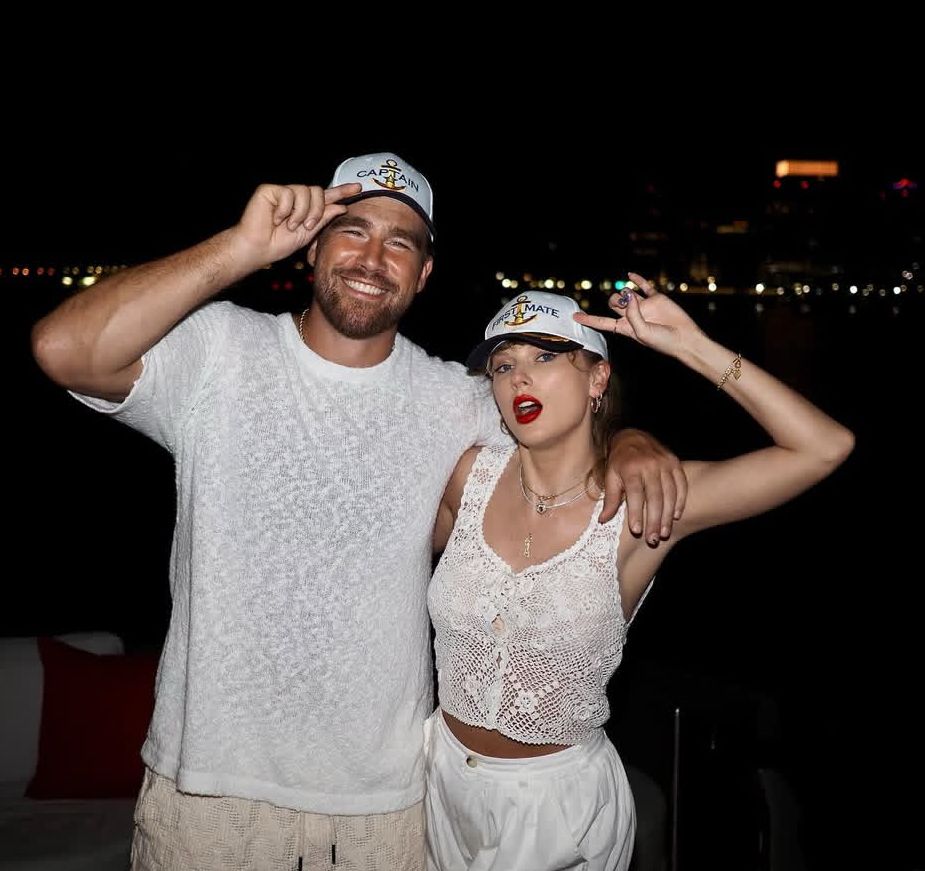 taylor swift and travis kelce dressed in white wearing matching hats 