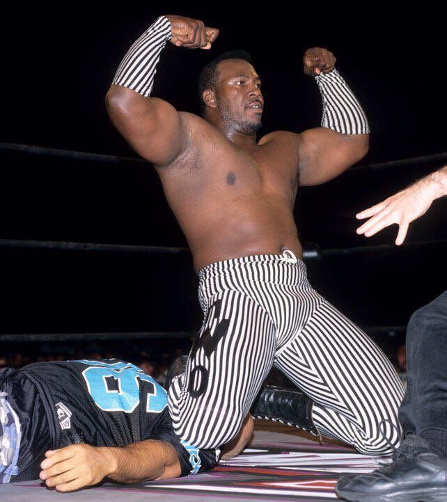 Image of nWo B Team Stevie Ray leader stunting on an unconscious Konnan