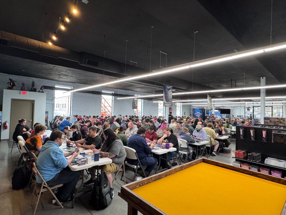 Tables full of gamers playing the Pokemon Trading Card Game