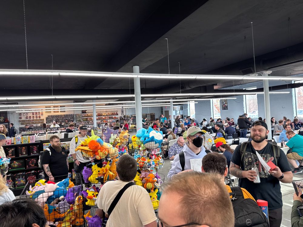 Tables of gamers playing pokemon tcg at full grip games in Akron Ohio