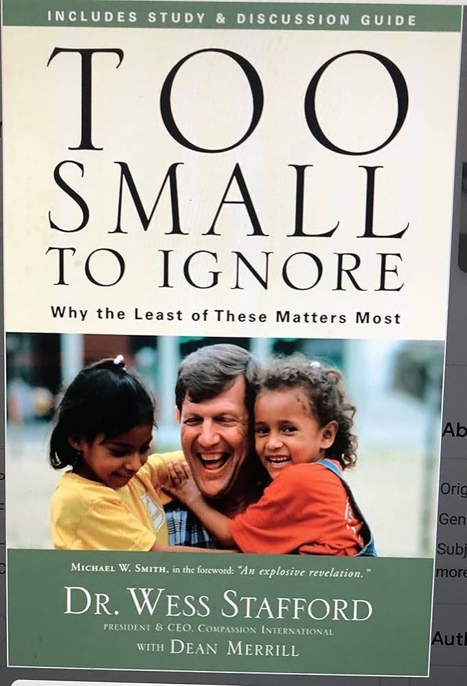 Bookcover of "Two small to ignore: Why the least of these matters most" by Wes Stafford. The cover includes a photo of the author with two young girls.