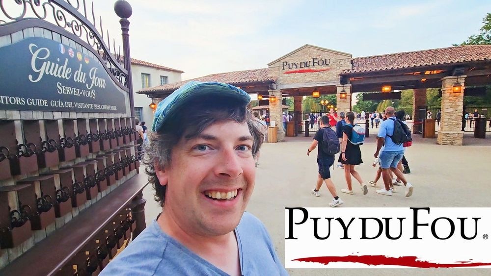 Peter wearing a silly hat infront of the Puy du Fou brick entrance