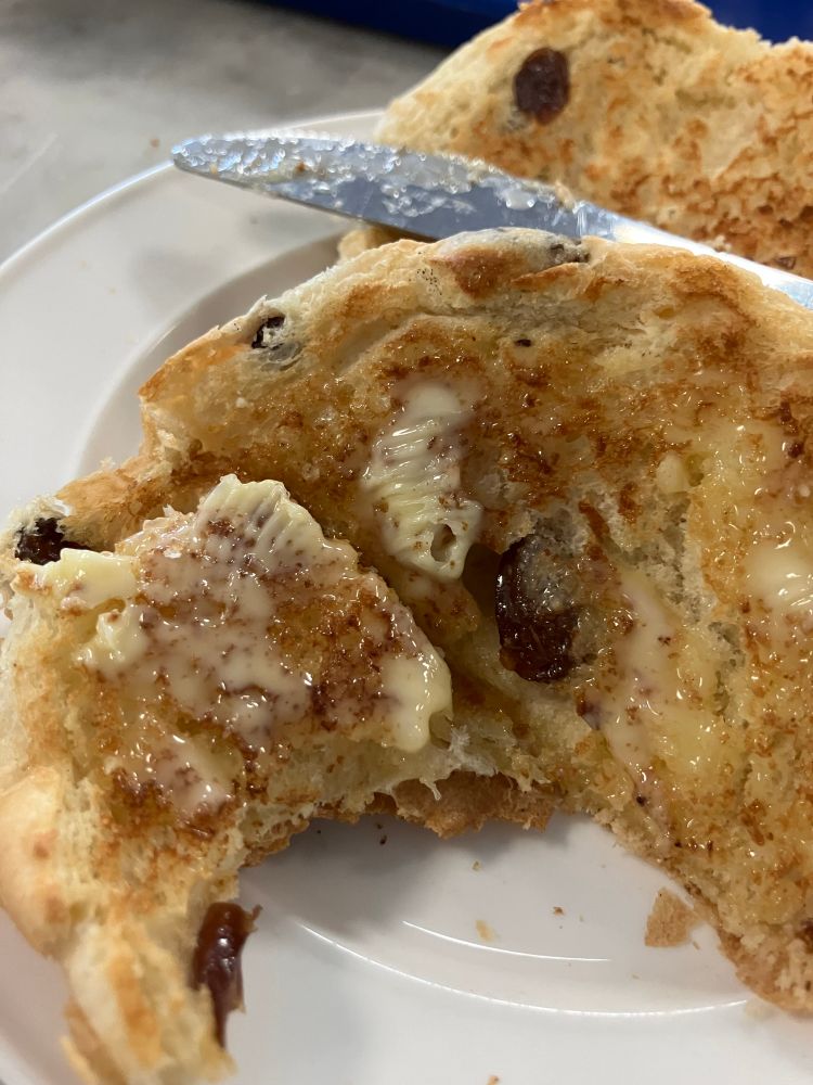 A toasted teacake, glistening with beautiful butter. Yum.