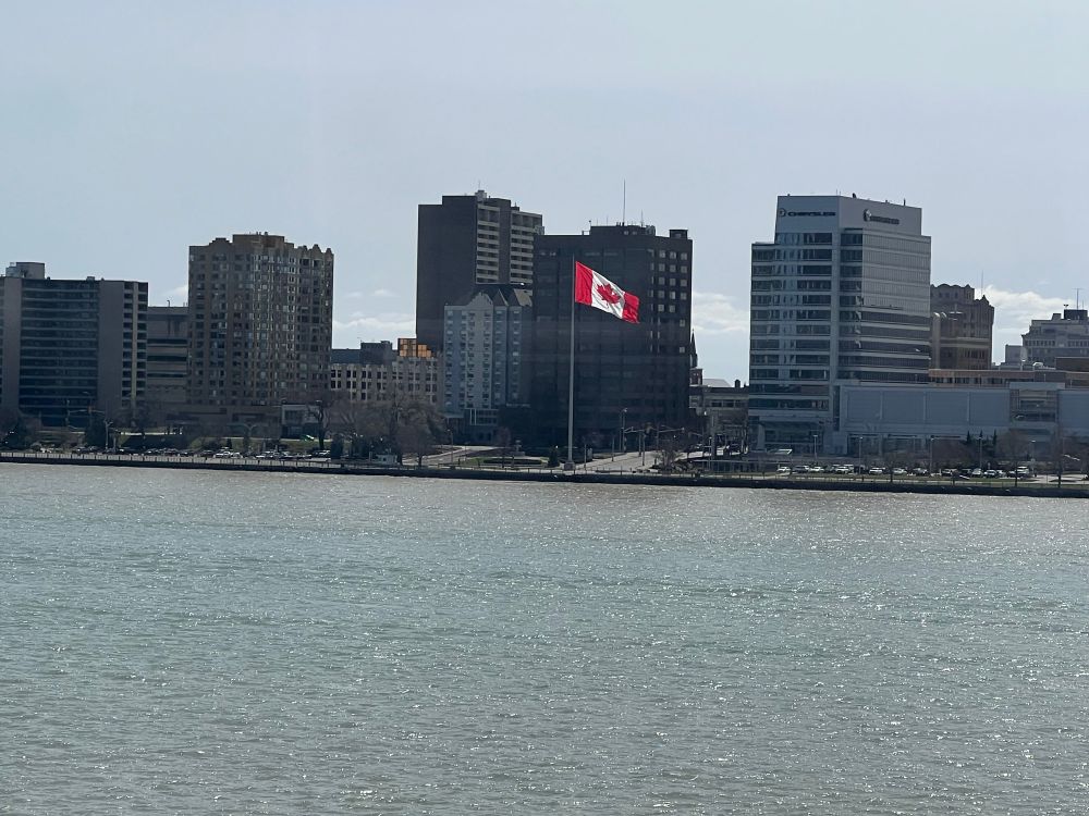 Detroit River and Windsor, with a close-up of the flag…