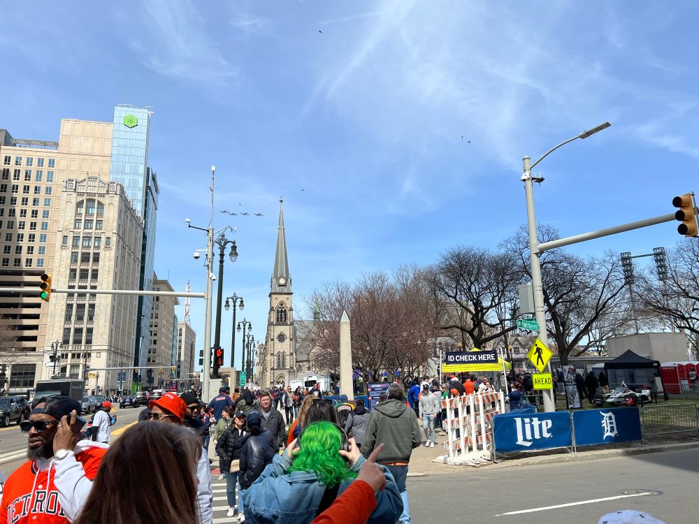 Looking down Woodward Ave. you can see the Air Force fly-by just to the left of the church steeple.