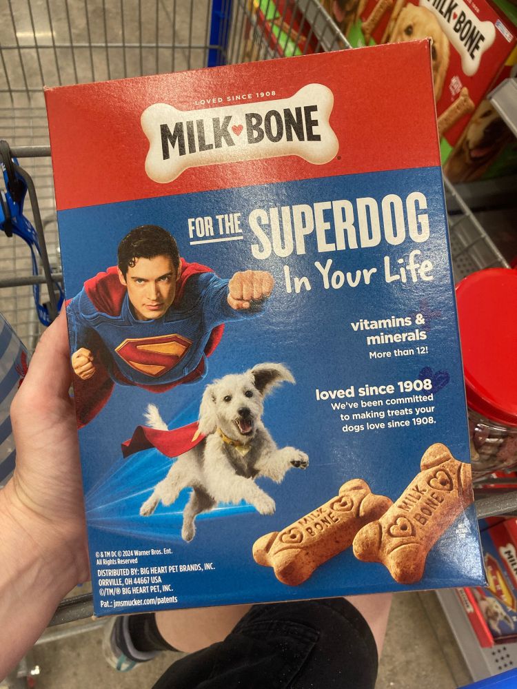 Box of Milk Bone dog treats reading “for the Super Dog in your life” on the back, with Superman and Krypto flying by.