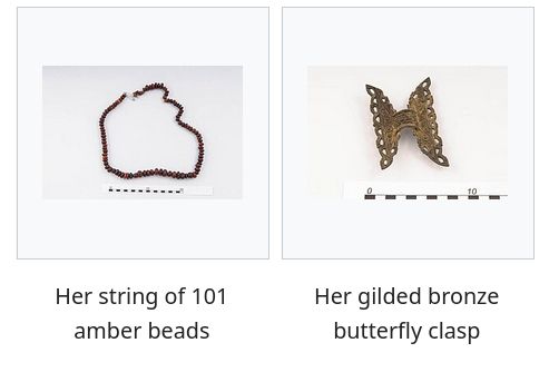 Wikipedia screenshot of images featuring, "Her string of 101 amber beads" and, "Her gilded bronze butterfly clasp"