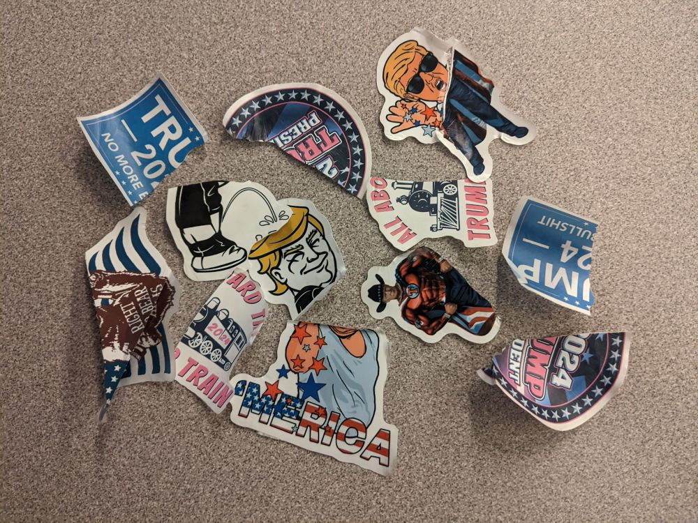 Buncha torn up trump stickers I ripped off lampposts and stuff lmao