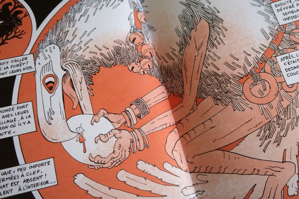 Photo of a comic panel : a creature, half bird half human, breaking a big egg with its beak.