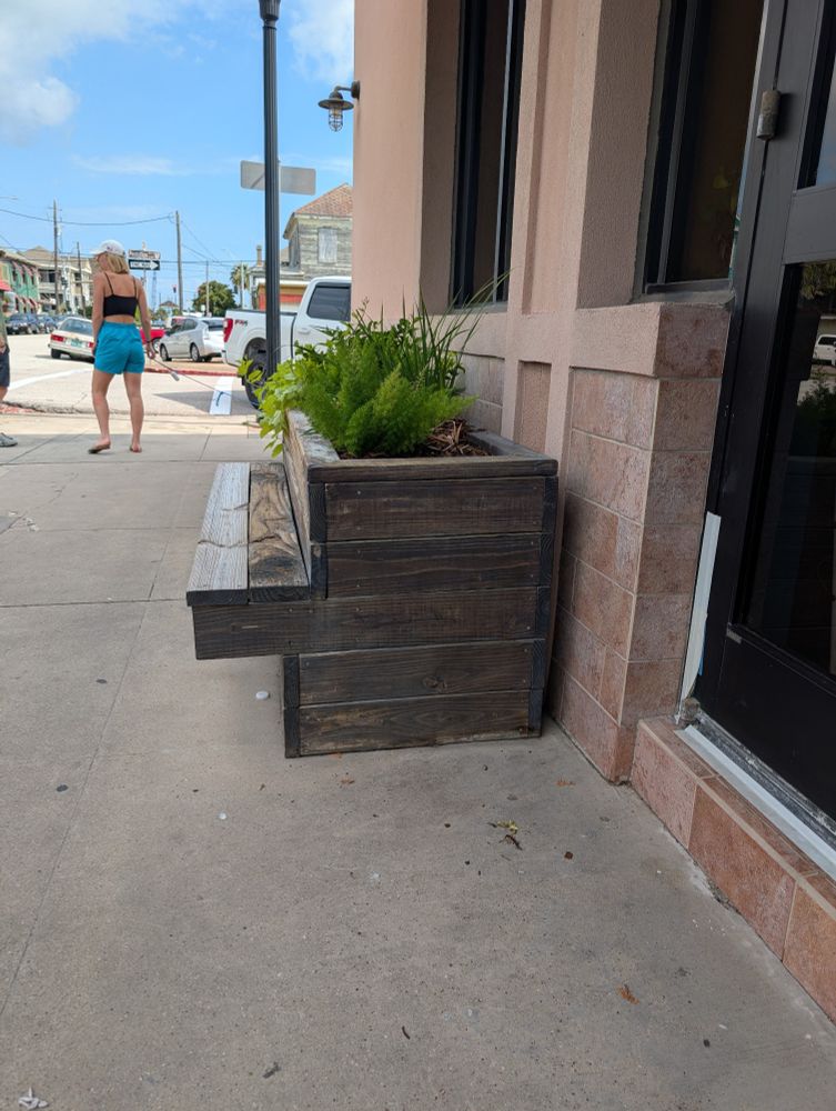 Planter benches on a sidewalk 