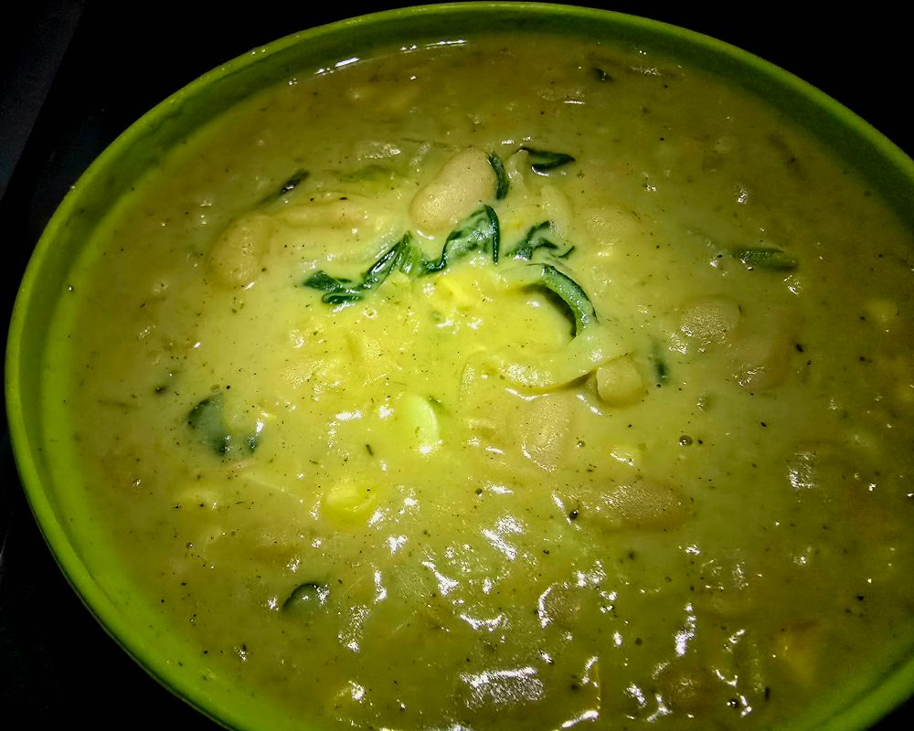 Butter Beans in Florentine Sauce

1 small onion, chopped
3 cloves garlic, minced
2 cans Butter beans, rinsed & drained
1 heaping cup Corn kernels
2 cups Veggie broth
5 oz Spinach 
8 oz Coconut milk
1/2 cup Parmesan cheese
Lemon juice, a healthy squirt
Pepper & Salt to taste

Directions 
Sauté well the onions, then add garlic.
Add Beans, Corn, Broth.  Simmer 15-20min
Add Spinch and wilt it in.
Lower heat.
Stir in Coconut Milk, Cheese, Lemon juice.
Pepper & Salt

Substitutions
-Parmesan Cheese for Nutritional Yeast to make it vegan.
-You can use Cannellini beans if you can't find Butter beans.