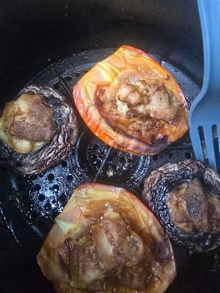 A roma tomato, sliced in half and 2 mushrooms. Both stuffed with some seasoned chicken thigh pieces. 

Roasted in an air fryer for 20 minutes at about 325 degrees