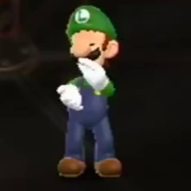 a cartoon character wearing a green hat and overalls is standing in the dark .