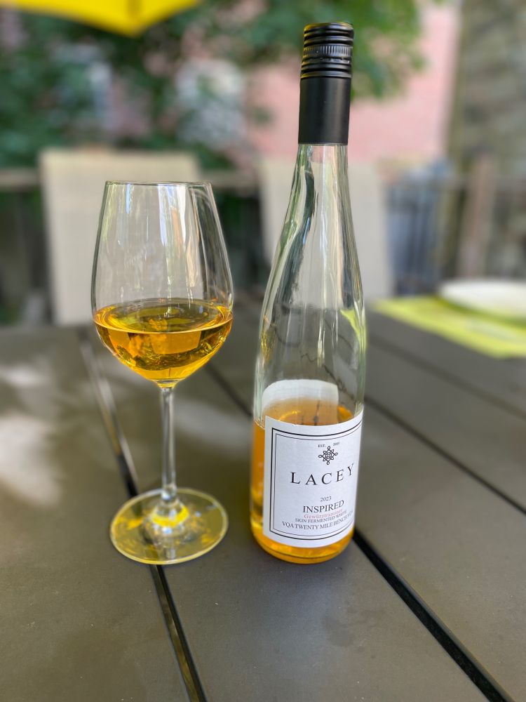 Bottle and glass of hertz in patio table