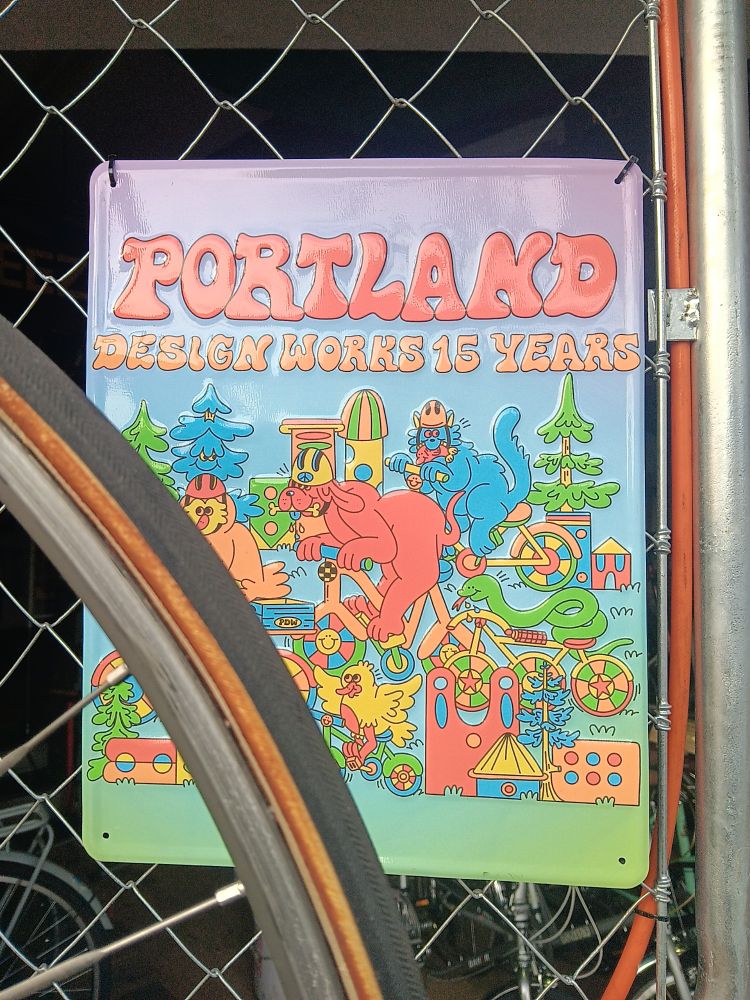 An ad in a bike shop window. It says Portland design works 15 years. I'm trying to find a dynamo powered light set.
