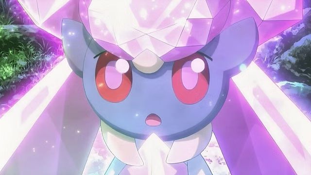 Diancie movie screenshot of her looking up, body aglow.