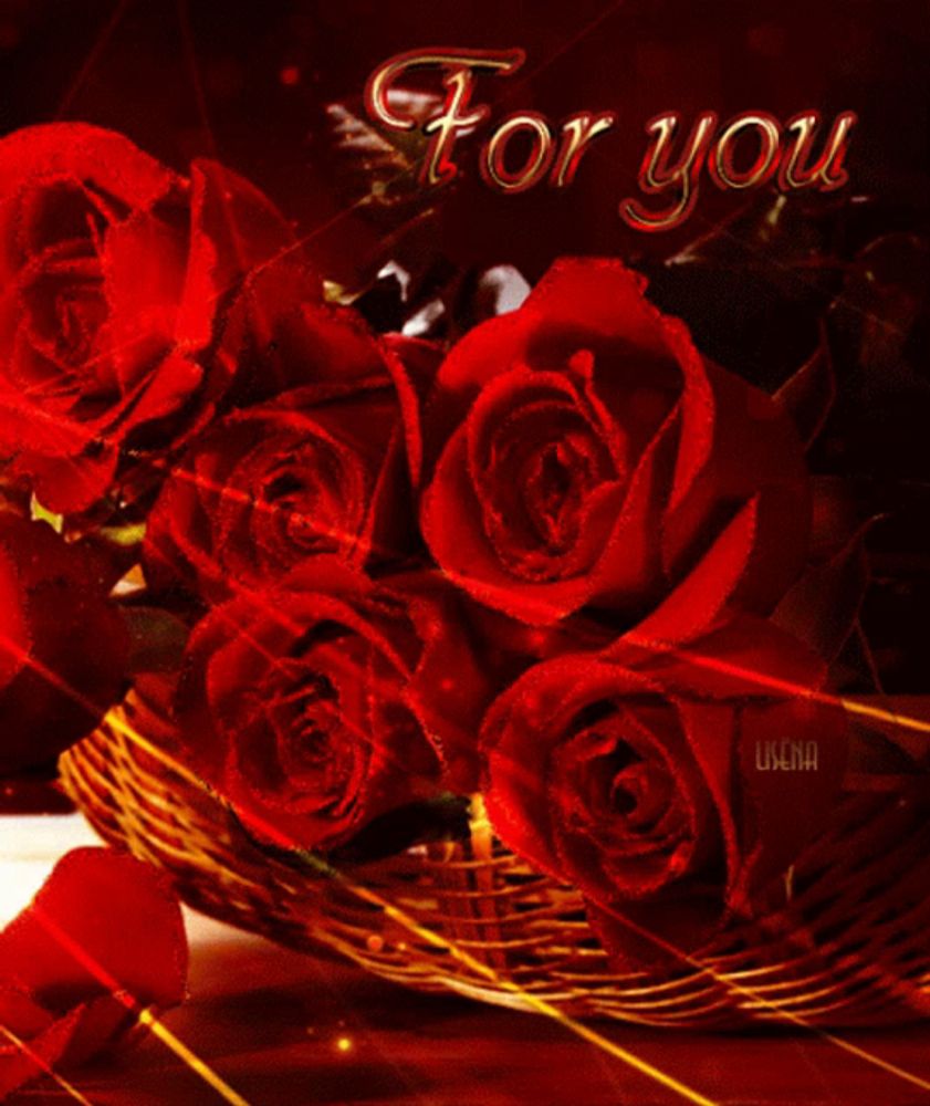 a bunch of red roses in a basket with the words " for you " on the bottom