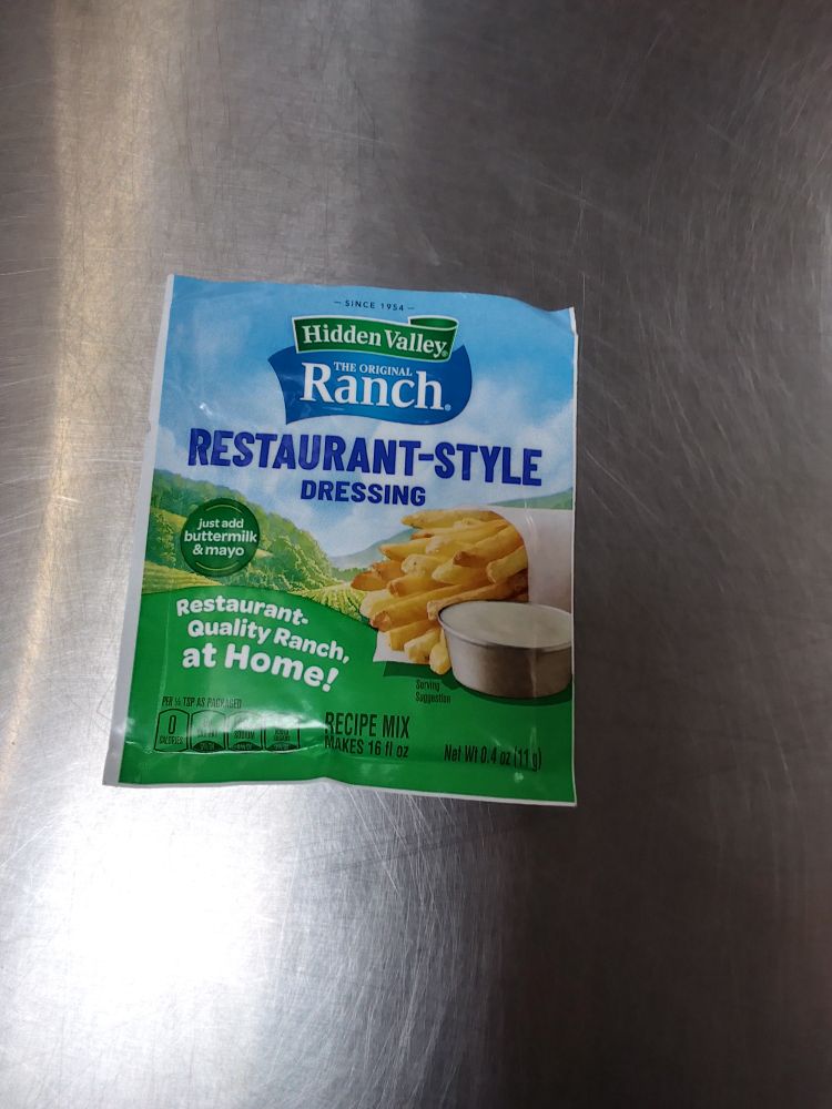 A packet of Hidden Valley Ranch Restaurant Style Dressing mix.