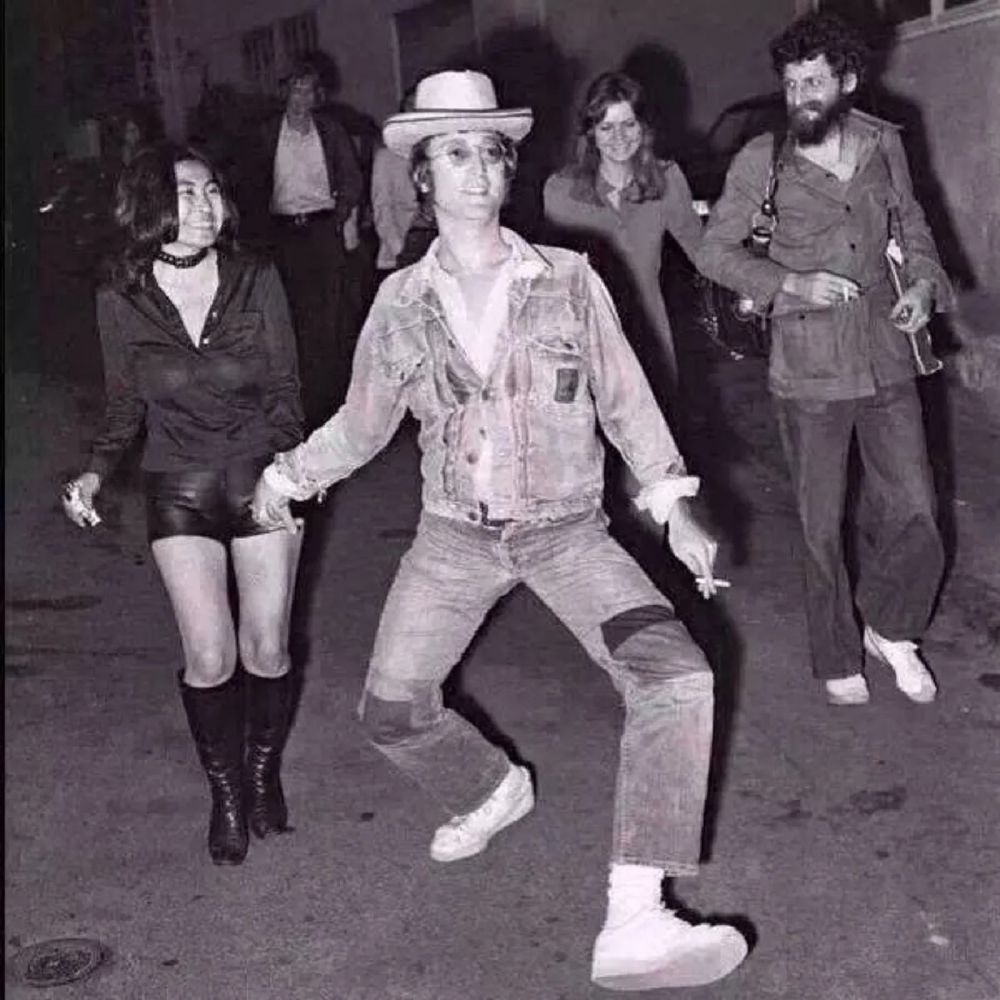 John Lennon doing a huge walk