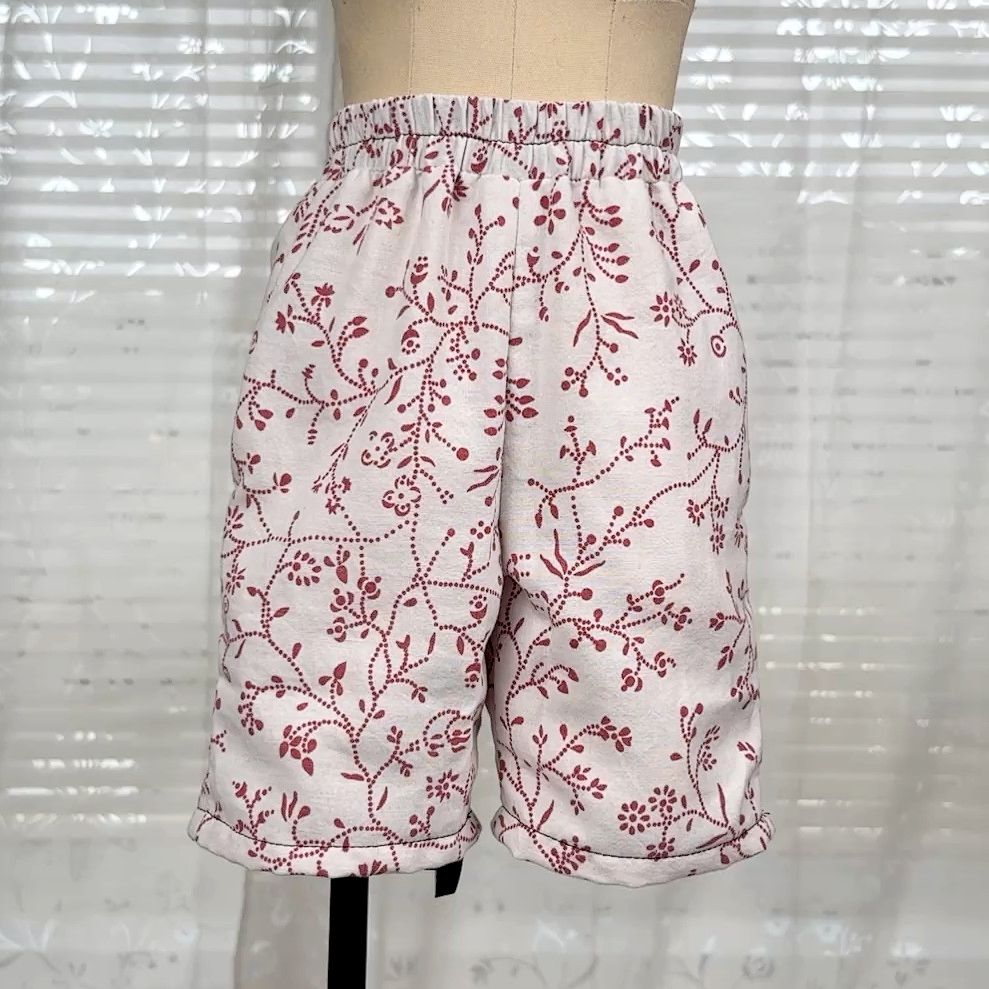 White Boxershorts with red floral pattern on a half scale dressform.
