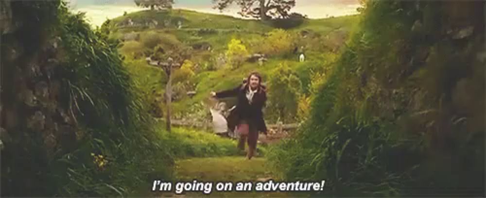 a woman is running through a lush green field and saying `` i 'm going on an adventure '' .