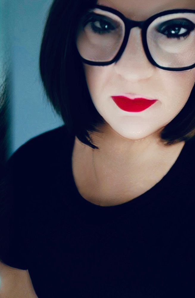 Sophie is a black dress and red lipstick 