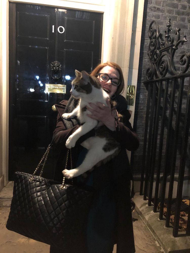 Picture of me outside number 10 Downing Street holding a very patient Larry the cat