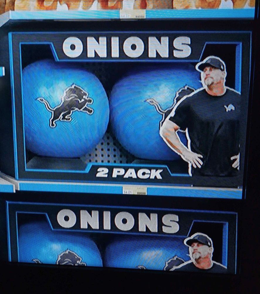 dan campbell with a 2-pack of onions