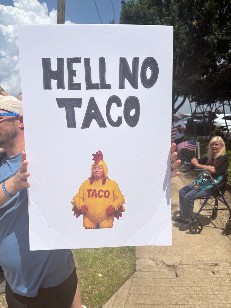 Protest sign reading Hell No Taco