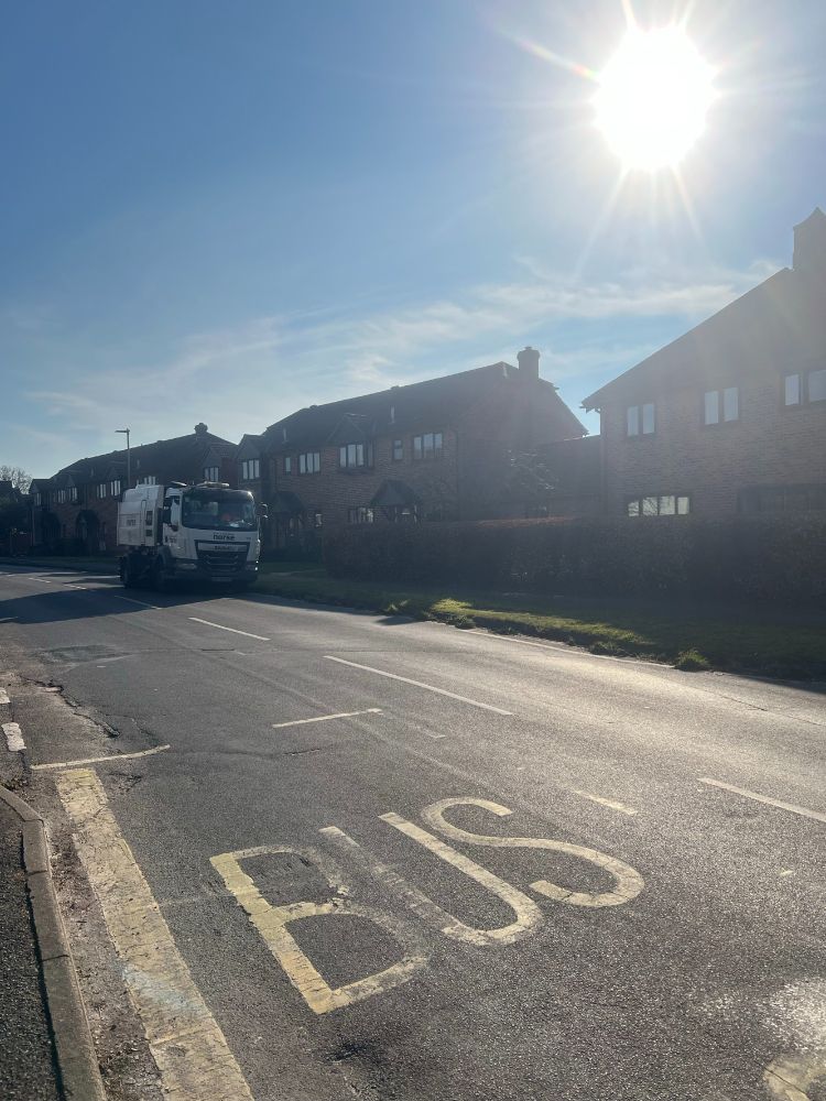 Road sweeper on a sunny day