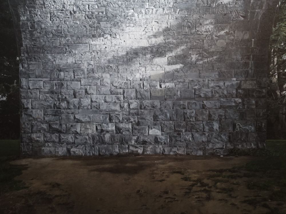 An oil painting of a stone wall.