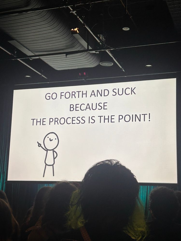 A slide from a presentation saying ‘go forth and suck because process is the point’ 