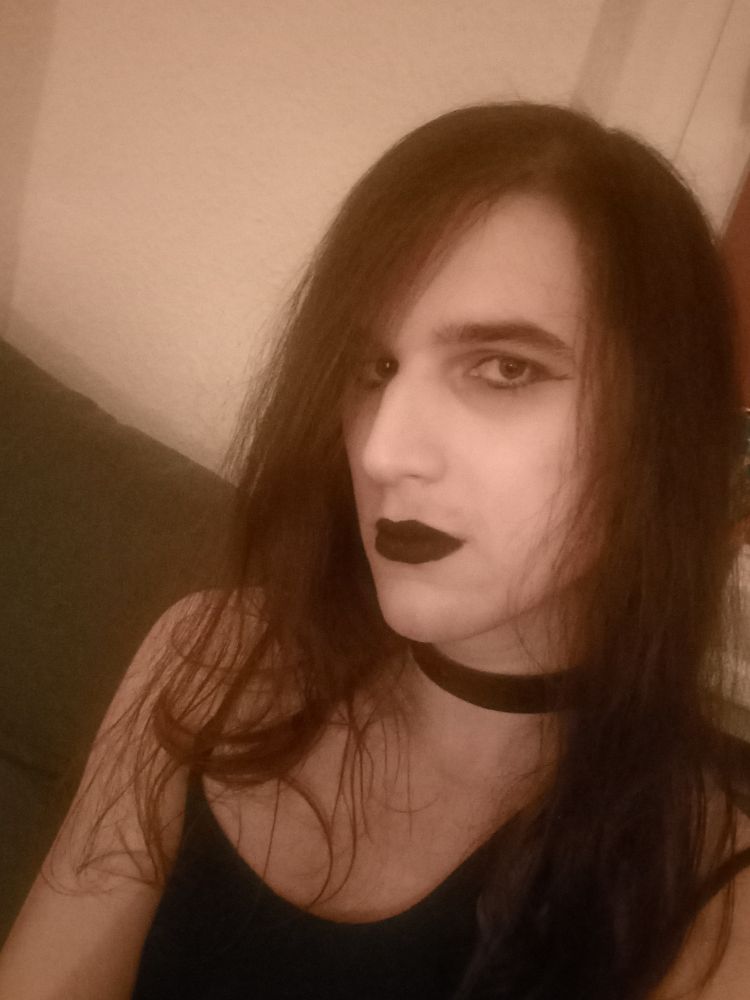 Me in a dress and with black makeup