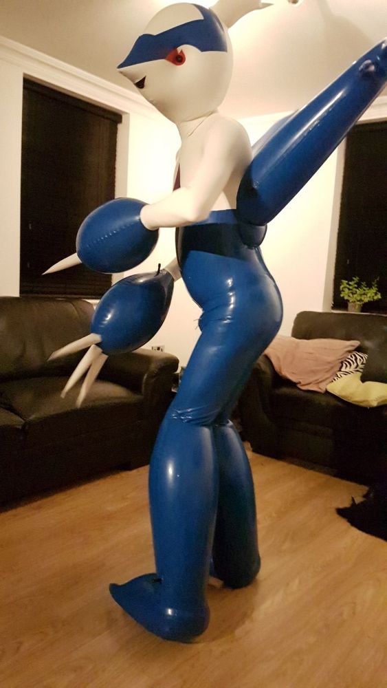 Me in my rubber Latios suit, side on but turned a little 