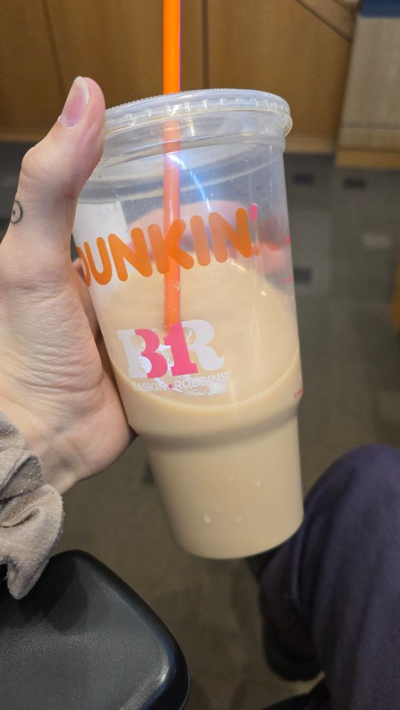 A half-finished cup of iced coffee from dunkin