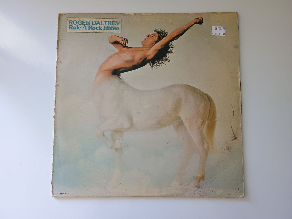 Roger Daltrey's “Ride A Rock Horse” album featuring Roger as the torso on the body of a white horse. 