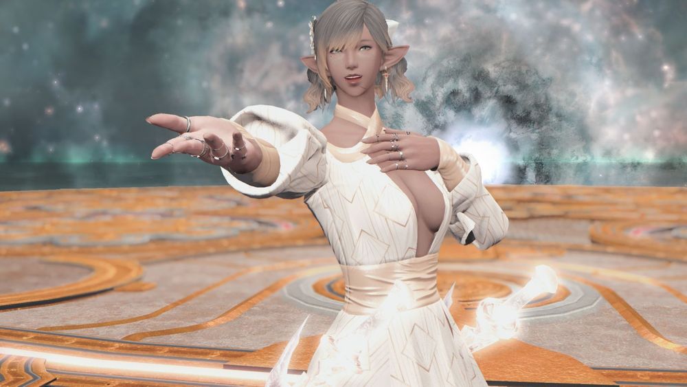 GPose screenshot of my Elezen, Tala. She is in the victory arena after clearing TEA. She's wearing a plunge dress in white and gold, and extending her hand hopefully towards the camera