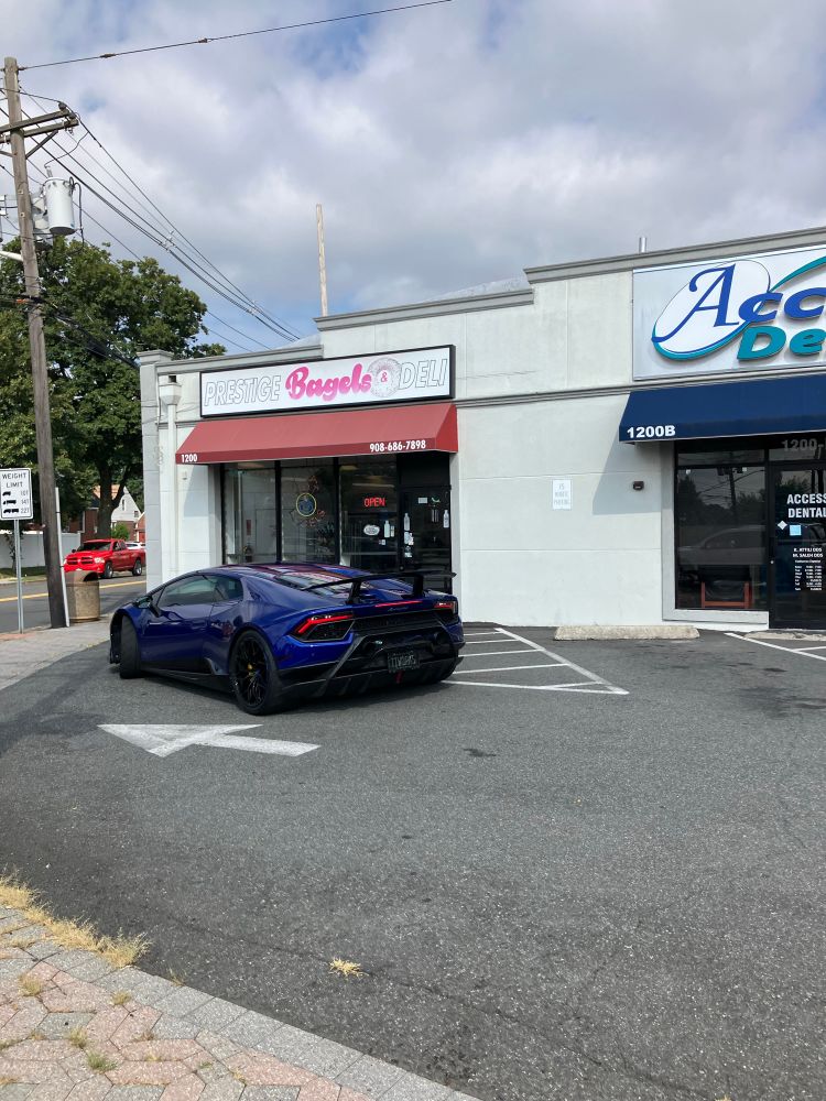 A blue Lamborghini outside of my local bagel place, the NJ license plate reads “TIWORKS” and appears to be custom made??