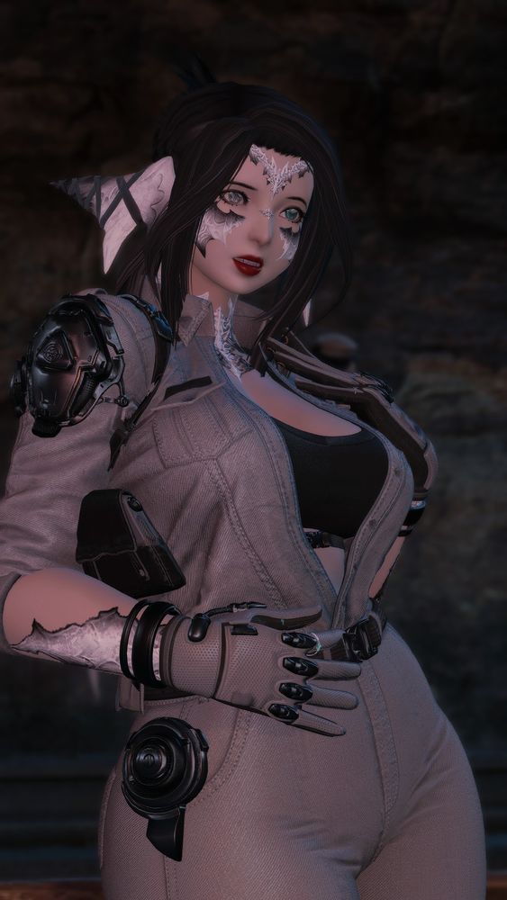 my oc in a denim suit with several tech-based accessories and a black sports bra. she stands in a cave, seeming to watch something happen in front of her with a look of concern and distaste